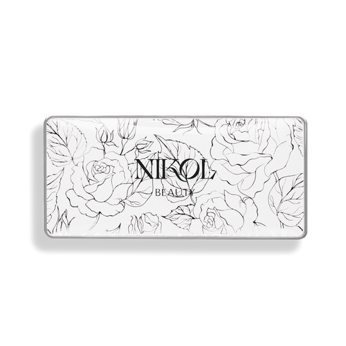 A rectangular beauty product package with black line drawings of roses and leaves on a white background features Nikol Beauty centered, hinting at a luminous finish of the After Glow Blush Palette made possible by natural ingredients.