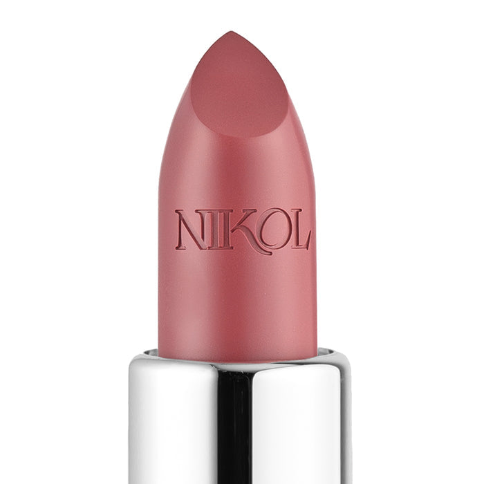 Close-up of Nikol Beautys Aperitif Shiny Velvet Cream Lipstick #419 in pink, featuring a pointed tip ideal for mature lips. The cruelty-free lipstick has a shiny silver base with NIKOL engraved on it, set against a white background.