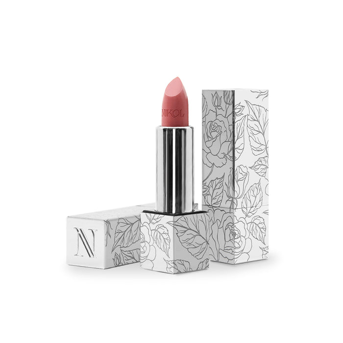 The Nikol Beauty Aperitif Shiny Velvet Cream Lipstick #419, in a sleek silver tube with its cap beside it, displays an N on the package. Both the cap and packaging have intricate black floral designs on white, emphasizing its hydrating formula ideal for mature lips.