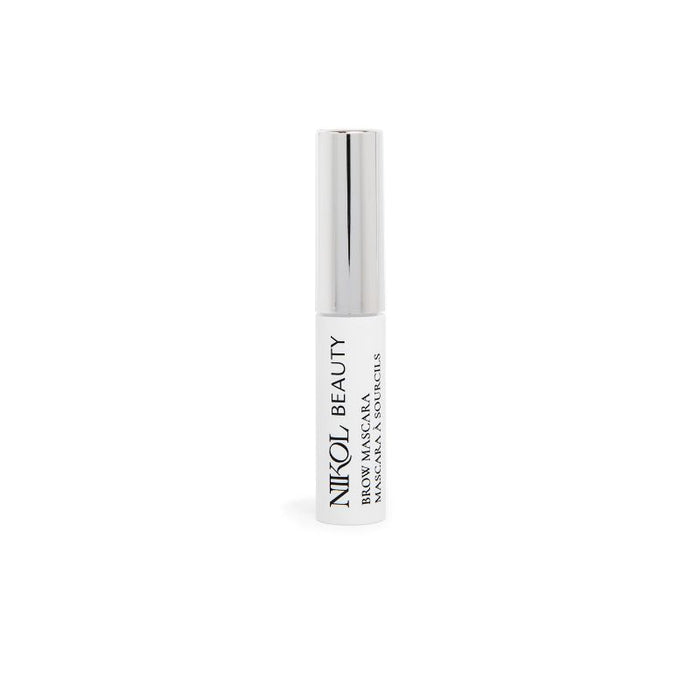 The Nikol Beauty Brow Mascara, in a white tube with a silver cap, stands upright on a plain white background. NIKOL BEAUTY BROW MASCARA is printed in black, promising defined eyebrows with its sleek and minimalistic design.