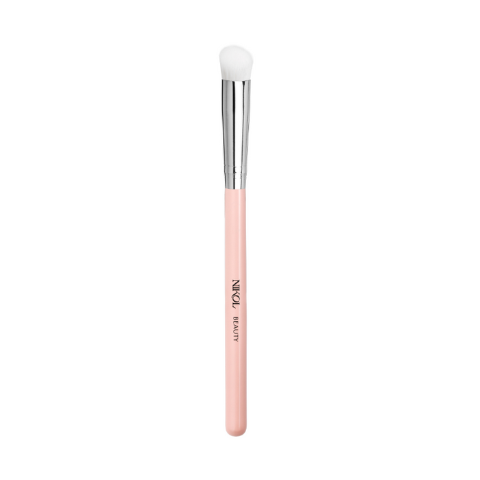 A cruelty-free Nikol Beauty Concealer Brush featuring a soft, rounded white bristle head, shiny silver ferrule, and light pink handle—ideal for flawless coverage.