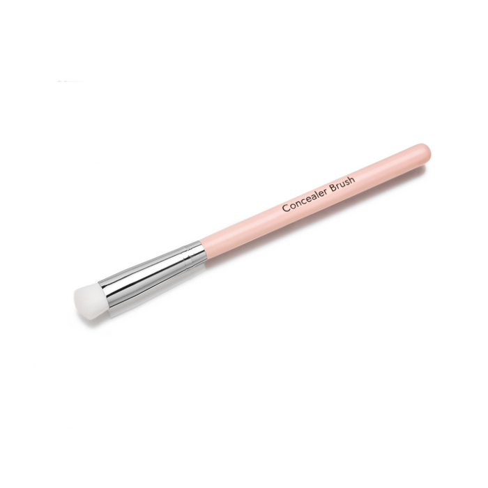 The Nikol Beauty Concealer Brush is cruelty-free with a light pink handle, silver ferrule, and white bristles. Diagonally placed on a white background, its labeled Concealer Brush and ideal for flawless coverage.