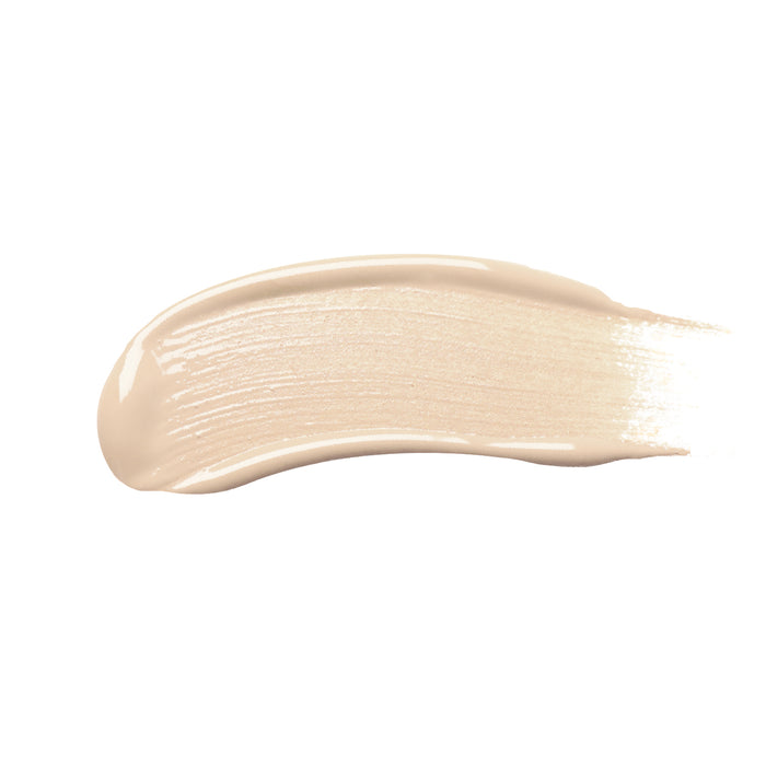 A smooth, creamy beige swatch of Nikol Beautys high coverage Creamy Concealer with a glossy finish spreads evenly across a white background, representing the essence of clean beauty.