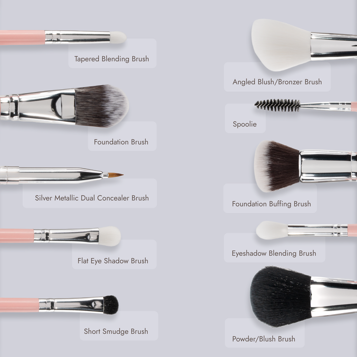 Nine labeled makeup brushes from the Nikol Beauty Essential Makeup Brush Set, each featuring unique brush heads and sizes, are arranged on a light gray background. The labels indicate a variety of uses—blending, foundation, concealer, blush, eyeshadow, spoolie, and powder—making this vegan set an ideal travel kit for your daily routine or on-the-go touch-ups.