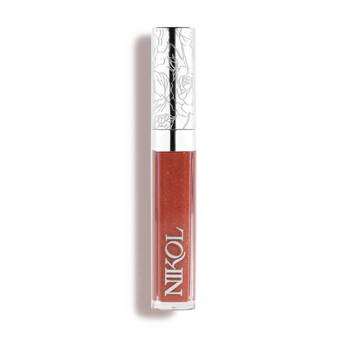 A tube of Nikol Beauty Ignite Lip Gloss #176 with a shiny silver floral cap and warm brown shimmer, perfect for mature women, stands upright against a white background.