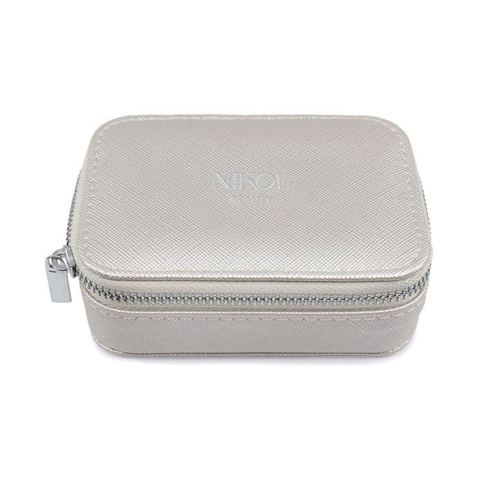 The Nikol Beauty Lipstick Case by Nikol Beauty is a gray, rectangular leather case with a textured finish. Featuring a zipper closure and NINOL embossed on top, its crafted from vegan material, combining style and sustainability.