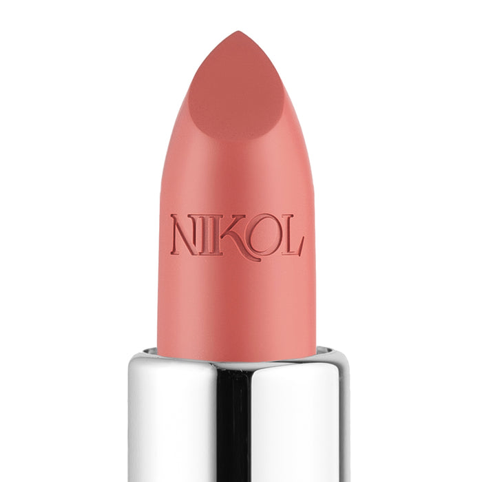 A close-up of NikRay Shiny Velvet Cream Lipstick #701 by Nikol Beauty features a light pink hue ideal for mature lips. Its hydrating formula with cruelty-free elegance is embossed on the tube, housed in shiny silver metallic casing against a plain white background.