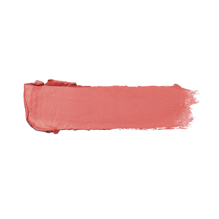 A swatch of Nikol Beautys NikRay Shiny Velvet Cream Lipstick #701 in matte pink smears across a white background, showcasing its texture and hydrating, cruelty-free formula.