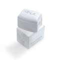 The Nikol Beauty Pencil Sharpener, an essential for any makeup bag, features a white design with silver lettering and floral patterns on its rectangular base. It has a removable top and is ideal for achieving professional eyeliner application.