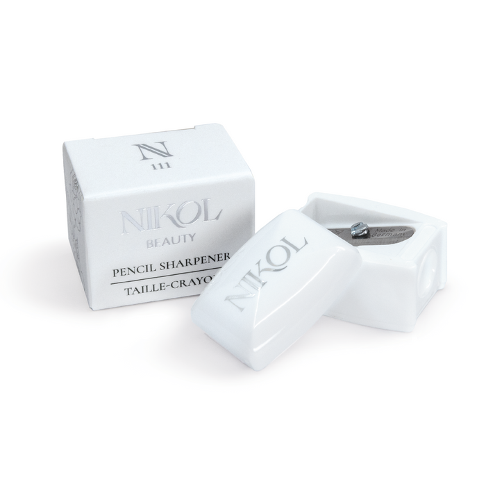 The Nikol Beauty Pencil Sharpener is a makeup bag essential, featuring a professional blade in an elegant box. Its simple design with silver text makes it perfect for maintaining your eyeliners and ensuring flawless application every time.