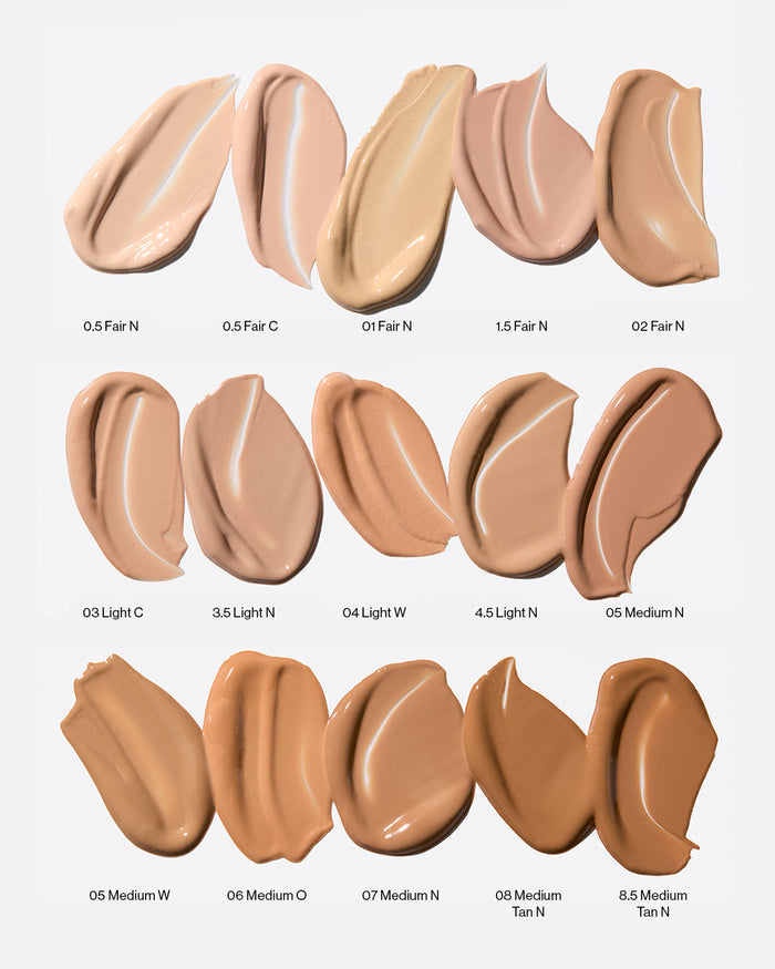 Concealer shade range featuring 15 swatches from Fair to Medium Tan, including neutral, cool, warm, and olive undertones. Shades progress from 0.5 Fair to 8.5 Medium Tan, offering inclusive coverage for a wide range of skin tones. Perfect for finding your ideal foundation match.