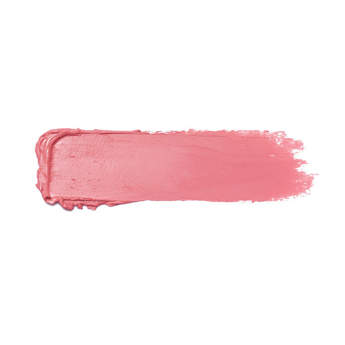 A smear of Nikol Beauty’s Pretty Smart Shiny Velvet Cream Lipstick #337 on a white background reveals its ultra-creamy, hydrating texture with slightly uneven edges, offering an elegant and feminine soft rosy pink hue.