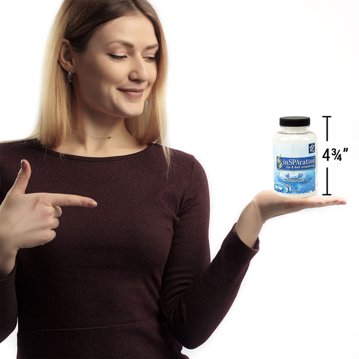 woman holding bottle of Insparation aromatherapy