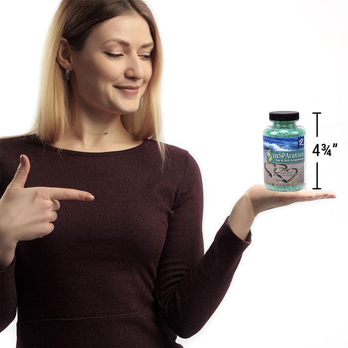 woman holding bottle of Insparation aromatherapy