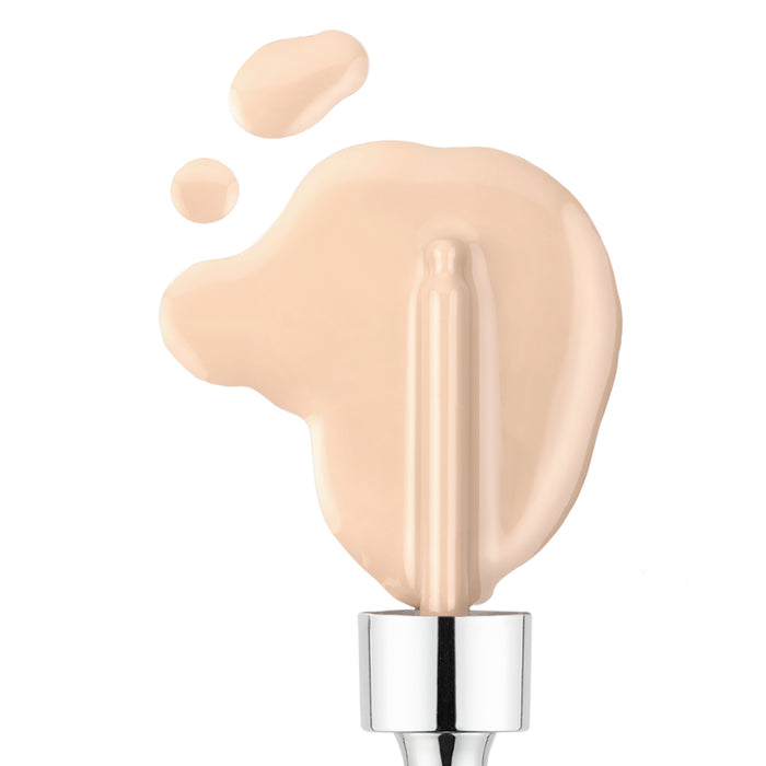 The Nikol Beauty Serum Foundation, with its smooth creamy texture and light beige shade, is spread next to drops using a silver applicator, offering customizable coverage for a flawless finish that aligns with clean beauty standards.