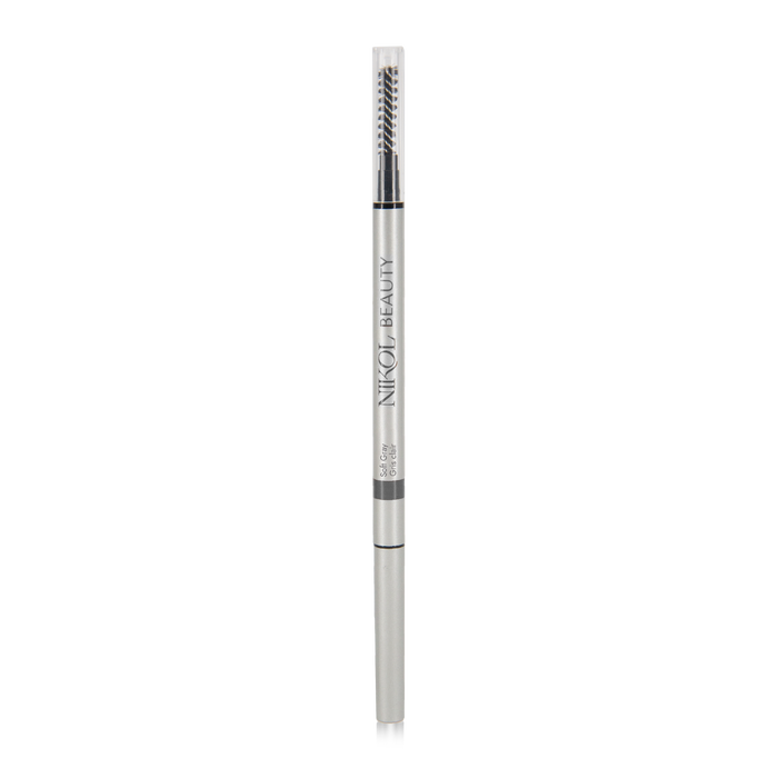 The Skinny Brow Pencil by Nikol Beauty features a sleek silver design with an ultra-smooth formula. It has Nikol Beauty in black vertical text and includes a spoolie brush on one end and a retractable tip for perfect eyebrow definition.