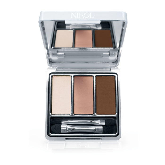 The Nikol Beauty Strong Brew 3-Well Eyeshadow Palette features an open silver case with a mirror, three matte shades (light beige, medium peach, dark brown), and a dual-ended applicator brush. The silky texture of the eyeshadows is infused with shea butter.