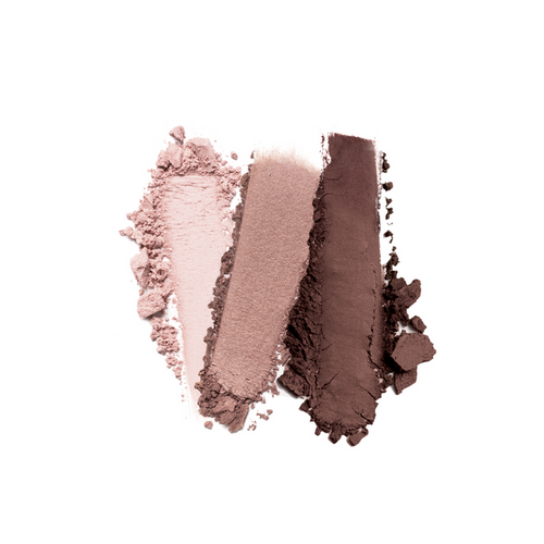 Swatches of crushed eyeshadow from Nikol Beautys Sweet Carol 3-Well Eye Shadow Palette are displayed on a white background, featuring clean beauty in pale pink, metallic mauve, and deep brown hues with vegan-friendly textures—soft powdery clumps and fine dust.