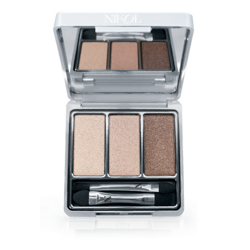 Introducing The Cabana 3-Well Eyeshadow Palette by Nikol Beauty, a vegan set featuring light beige, medium tan, and dark brown shades. It comes with a dual-ended applicator and sleek silver packaging with a clear top for brand display.