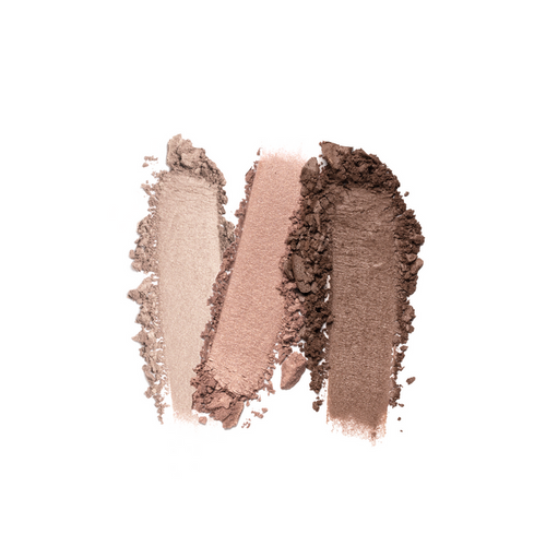 Three eyeshadow swatches in light beige, pink, and dark brown are displayed on a white background, showcasing their textured, powdery finish. Discover effortlessly stunning looks with Nikol Beautys vegan The Cabana 3-Well Eyeshadow Palette.