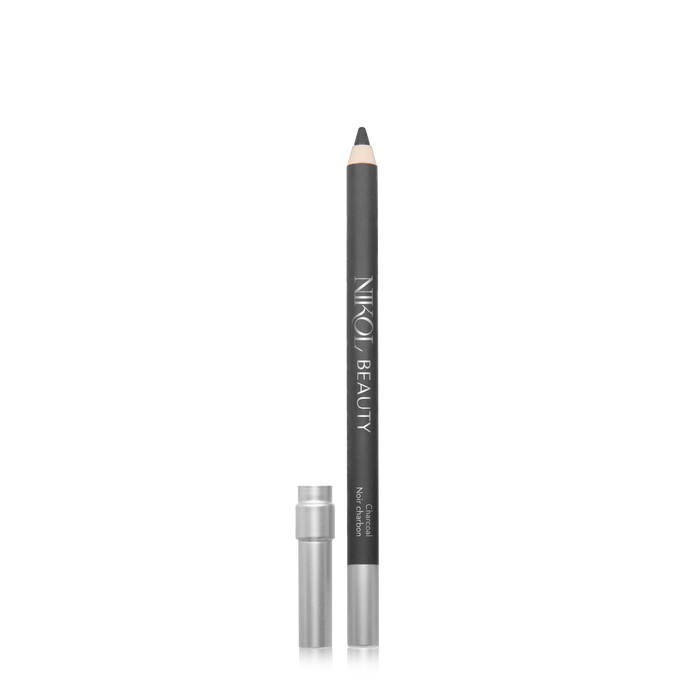 A Nikol Beauty WaterProof Eyeliner Pencil stands vertically with its sharp tip exposed and silver cap placed beside it on the left, against a plain white background. Ideal for mature eyes, it features long-lasting pigments.