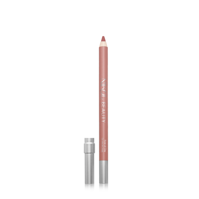A nude pink WaterProof Lip Liner Pencil by Nikol Beauty stands upright, cap aside, showcasing a sharpened tip. Perfect for mature women’s makeup, its creamy formula glides seamlessly on a crisp white background.